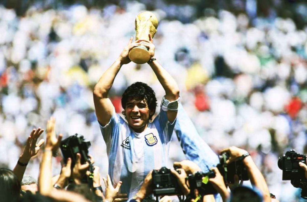 Diego Maradona lifting 1986 World Cup trophy