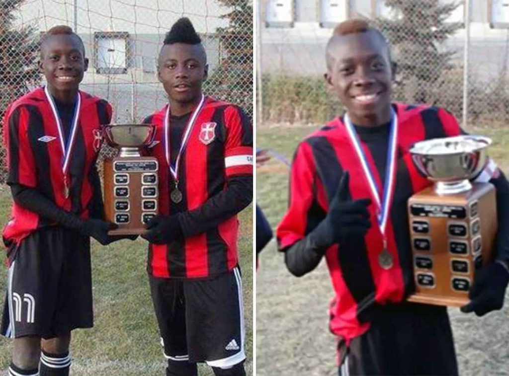 Small Alphonso Davies with trophy